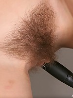 Marizza casually brushes her pussy hair before using the handle as a dildo. She only gets hornier and fills herself with warm water then squirts it ou
