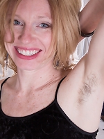 Lacy is a horny blonde who likes to take her clothes off and show off her hairy pussy. After she takes her clothes off she spreads apart her wet hairy